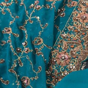 Embroidered Teal Fabric with Gold and Pink Accents